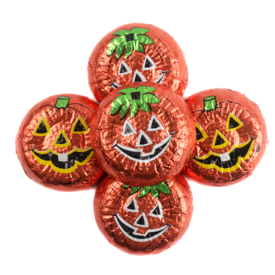 Chocolate wafers wrapped in orange foil with smiling jack-o'-lantern faces
